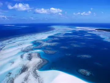Vast Blue Coral Atolls wallpaper