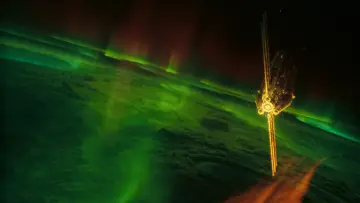 Satellite Above Northern Lights wallpaper