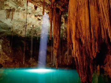 Sunlight Piercing Underground Cave wallpaper