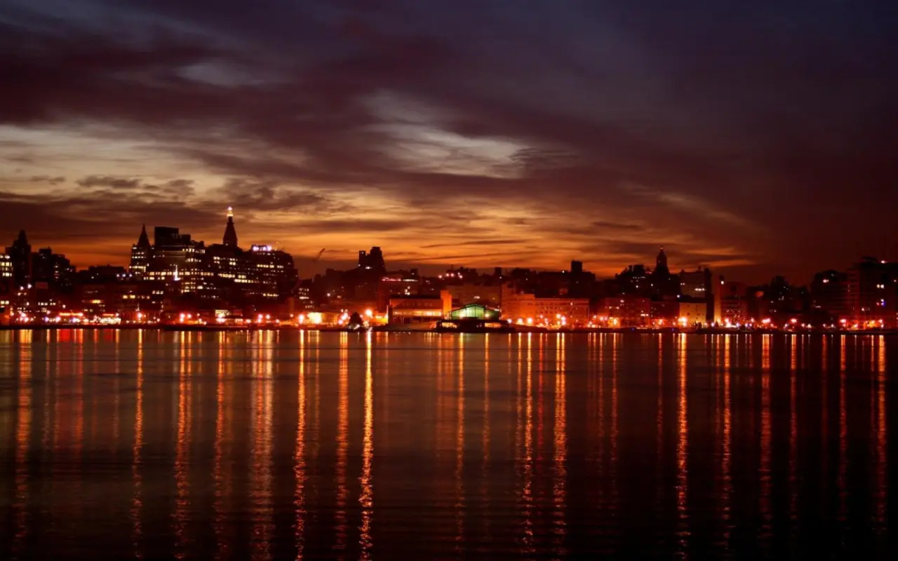 Twilight Skyline Over Water – black and brown desktop wallpaper, 1680×1050