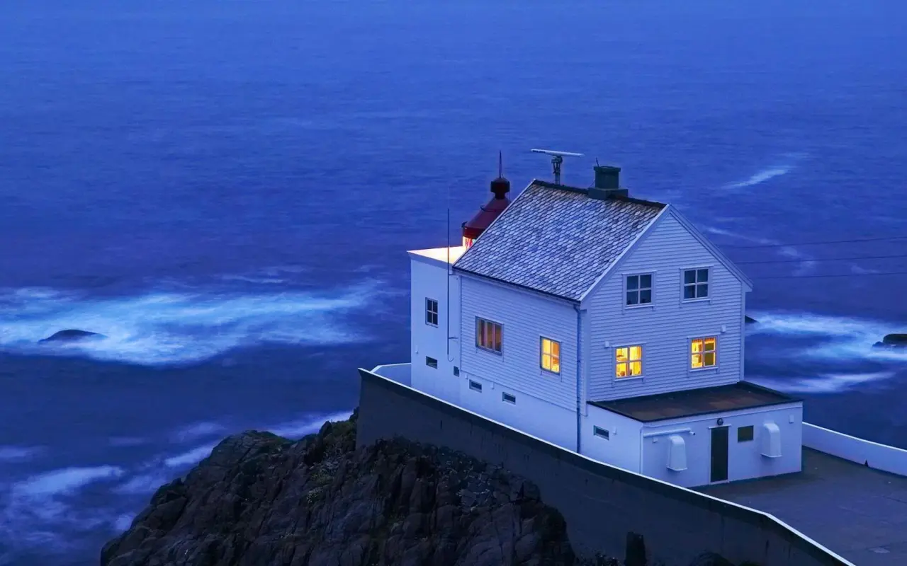 Beacon Over Dark Ocean – blue and purple desktop wallpaper, 1680×1050