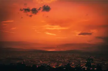 Fiery Orange Sky Over City wallpaper