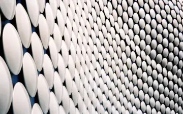Rhythmic White Discs in Perspective wallpaper