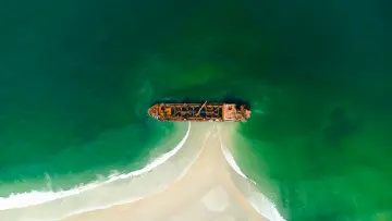 Shipwreck On Sandy Shore wallpaper