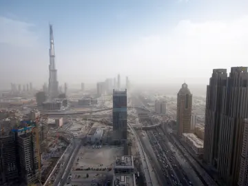 Skyscrapers Above Dusty Roads wallpaper
